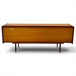 BCM (Bath Cabinet Makers) - mid-20th century teak sideboard, rectangular top with back gallery, left hand side fall front cupboard, centre cupboard opening to reveal a shelved interior, the right side with a bank of three drawers one fitted for cutlery, raised on inset tapering supports