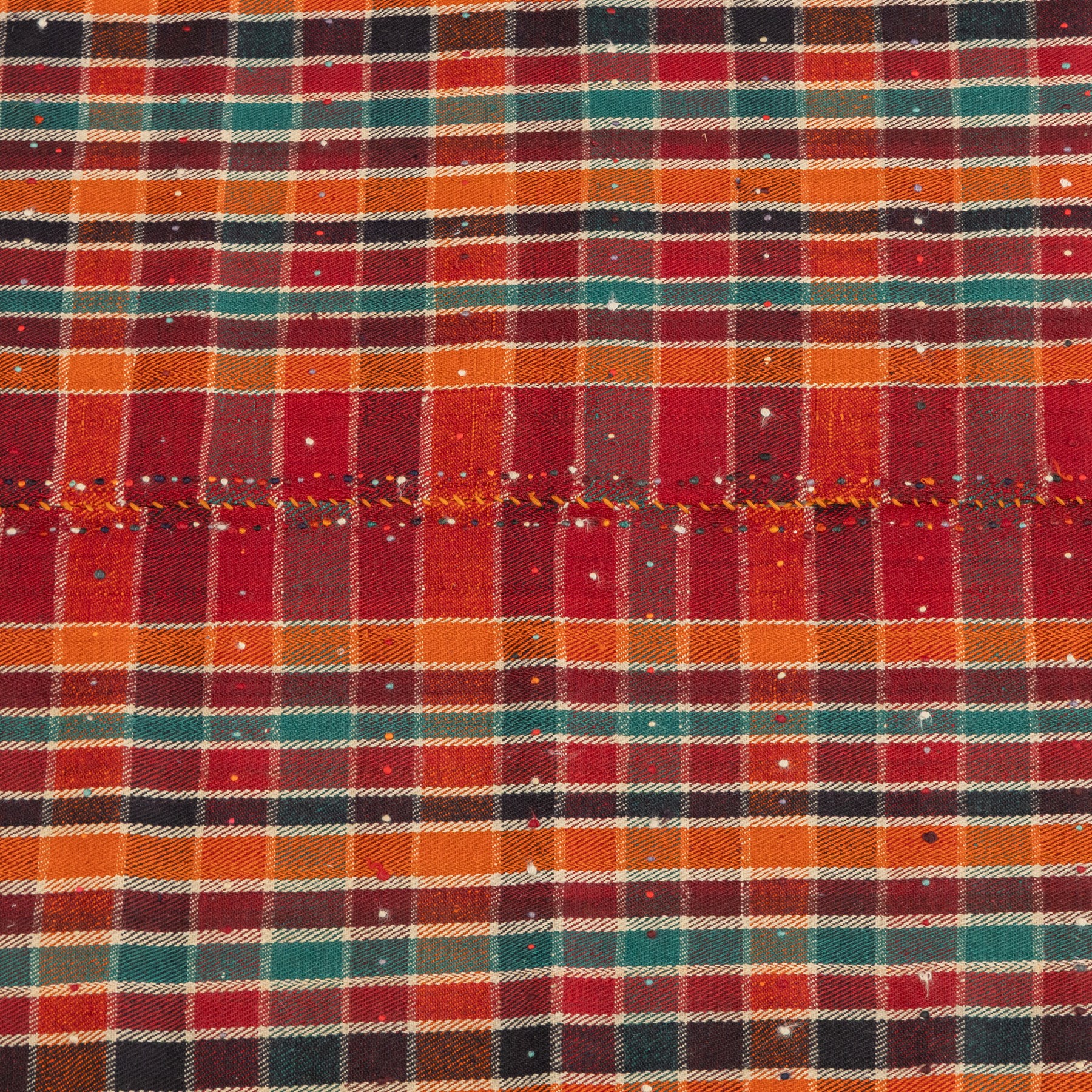 South West Persian Jajim kilim, formed from two joined flatwoven panels, patterned with intersecting stripes in red, orange, green, dark brown and ivory forming a checked design, scattered coloured dot motifs, multicoloured wool tassels along the sides