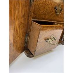 Victorian oak table top cabinet modelled in the form of a two door safe, the hinged twin doors with applied Royal crests opening to reveal one long drawer over two short drawers,