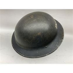 WW2 Home Front 'Police' black painted steel helmet with original liner and webbing chin strap, impressed R.O. Co. 1/1939; and re-painted shell only for WW2 Wardens steel helmet impressed AMC II 1941 C676 (2)