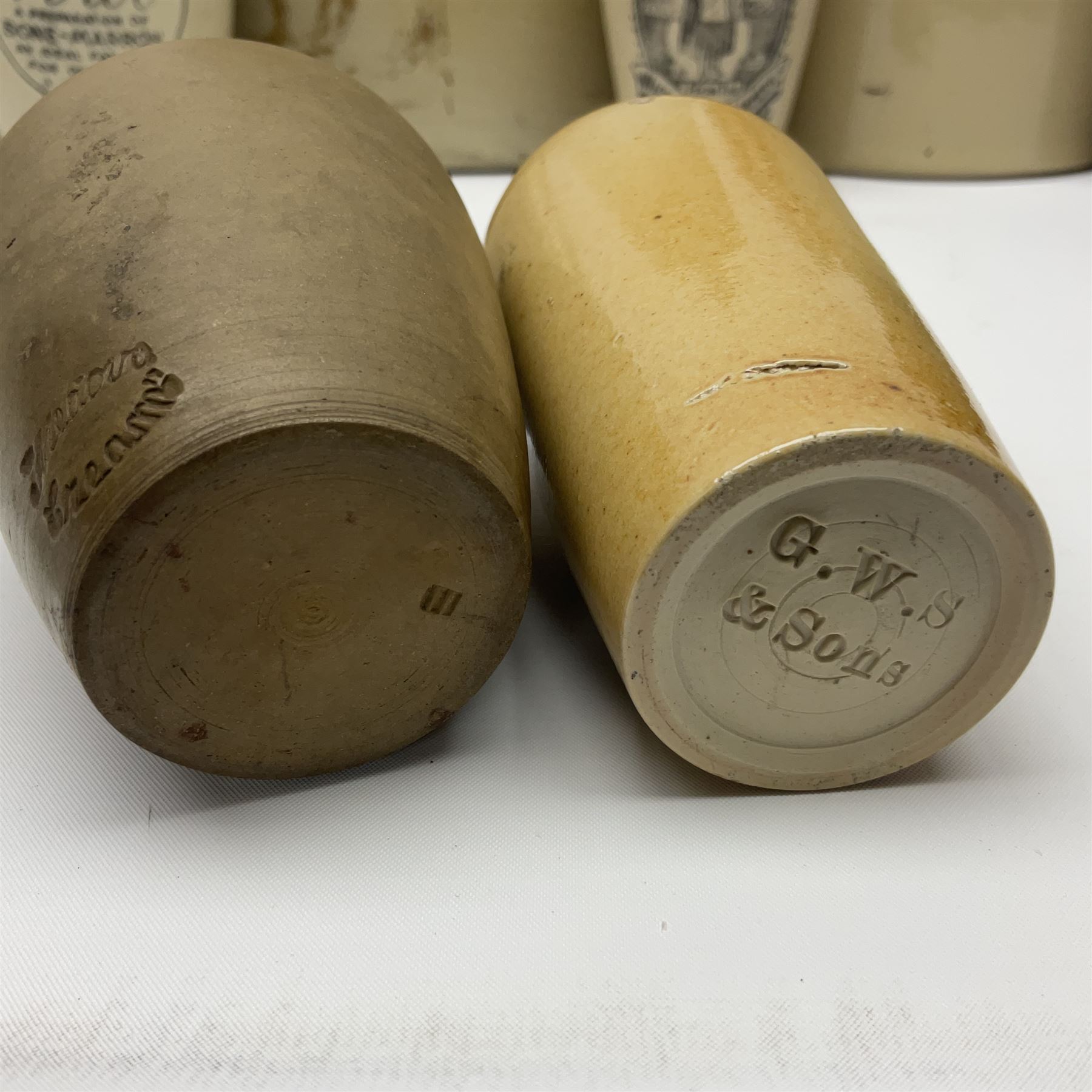 Large 2 gallon stoneware flagon, stamped 'John Soulby Wine Merchant Malton 2 Gall', together with a collection of similar stoneware jars and bottles, largest H40.5cm