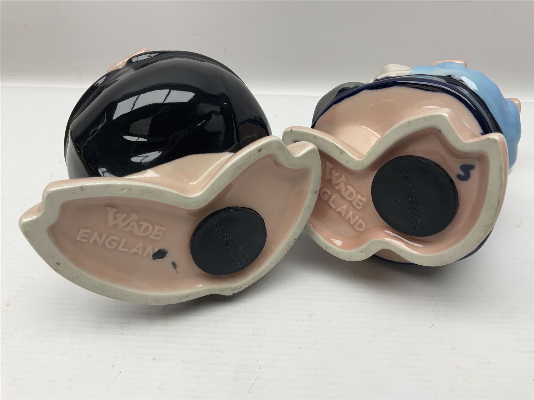 Set of five Wade NatWest money boxes, comprising father, mother, boy, girl and baby