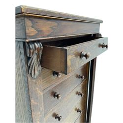 Victorian oak Wellington chest, fitted with seven drawers, lockable hinged side return