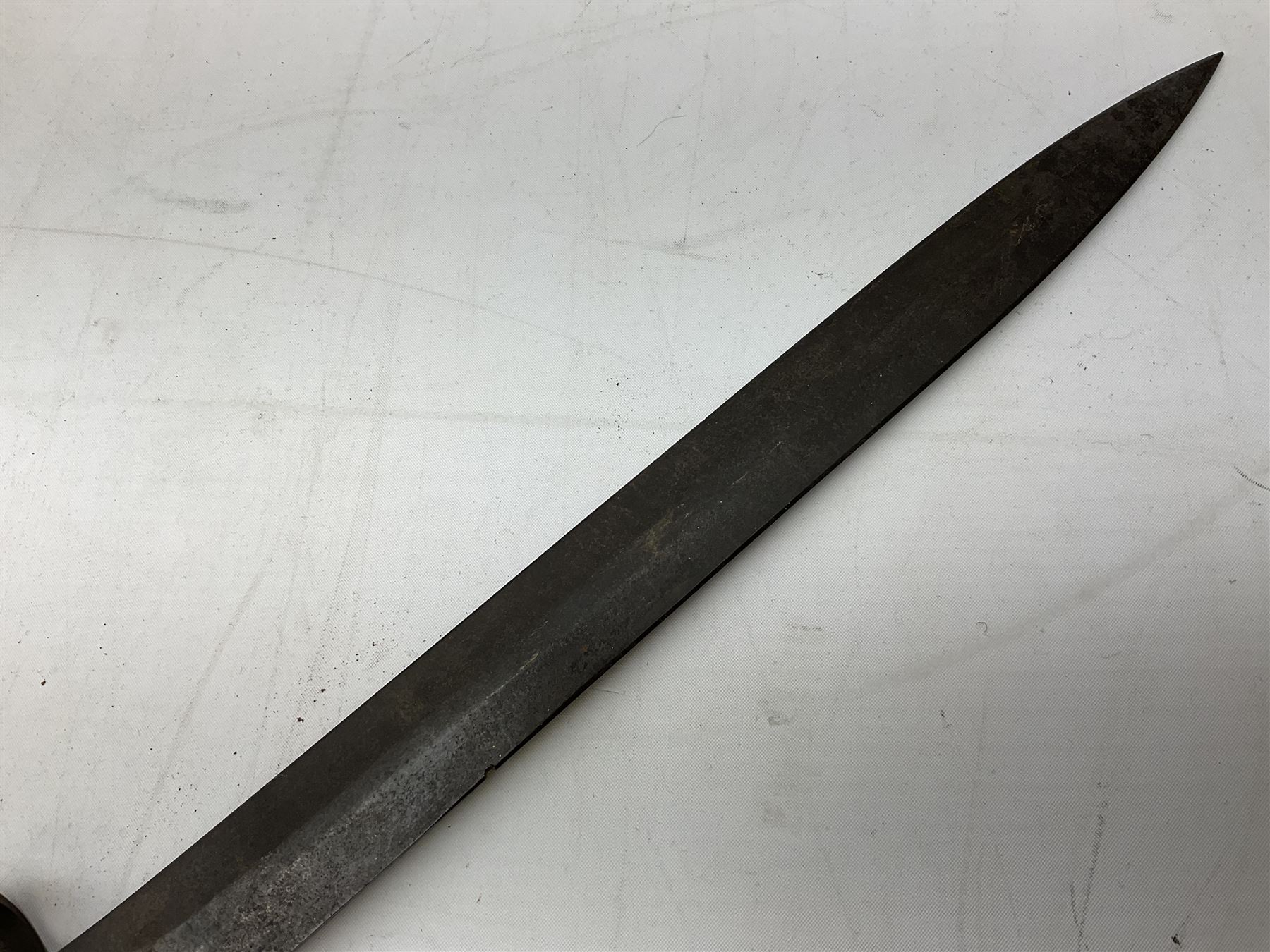 British Pattern 1907 bayonet with 43.5cm fullered steel blade; in leather scabbard with webbing frog L58cm overall; another Pattern 1907 bayonet lacking scabbard; and British Pattern 1888 Mk.I bayonet by Wilkinson London (no scabbard) (3)