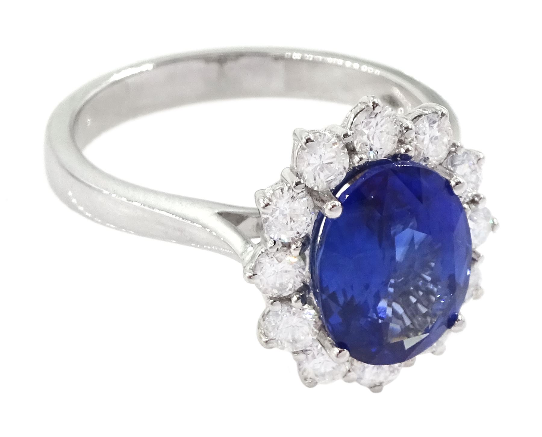 18ct white gold oval cut sapphire and round brilliant cut diamond cluster ring, hallmarked, sapphire approx 3.85 carat