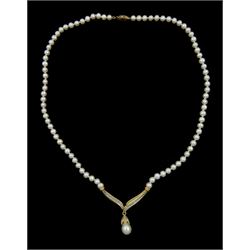  14ct gold pearl and round brilliant cut diamond necklace, suspending from a single strand cultured white pearl necklace, with gold clasp