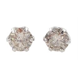 Pair of platinum round brilliant cut diamond stud earrings, stamped Pt 900, total diamond weight approx 0.30 carat