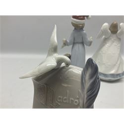 Three Lladro figures, comprising Dear Santa no 6166, Angelic Melody 1993 no 5963 and Seraphs Head no2 no 4885, together with Lladro plaque Love Brings Us Together no 7677, all with original boxes, largest example H18cm