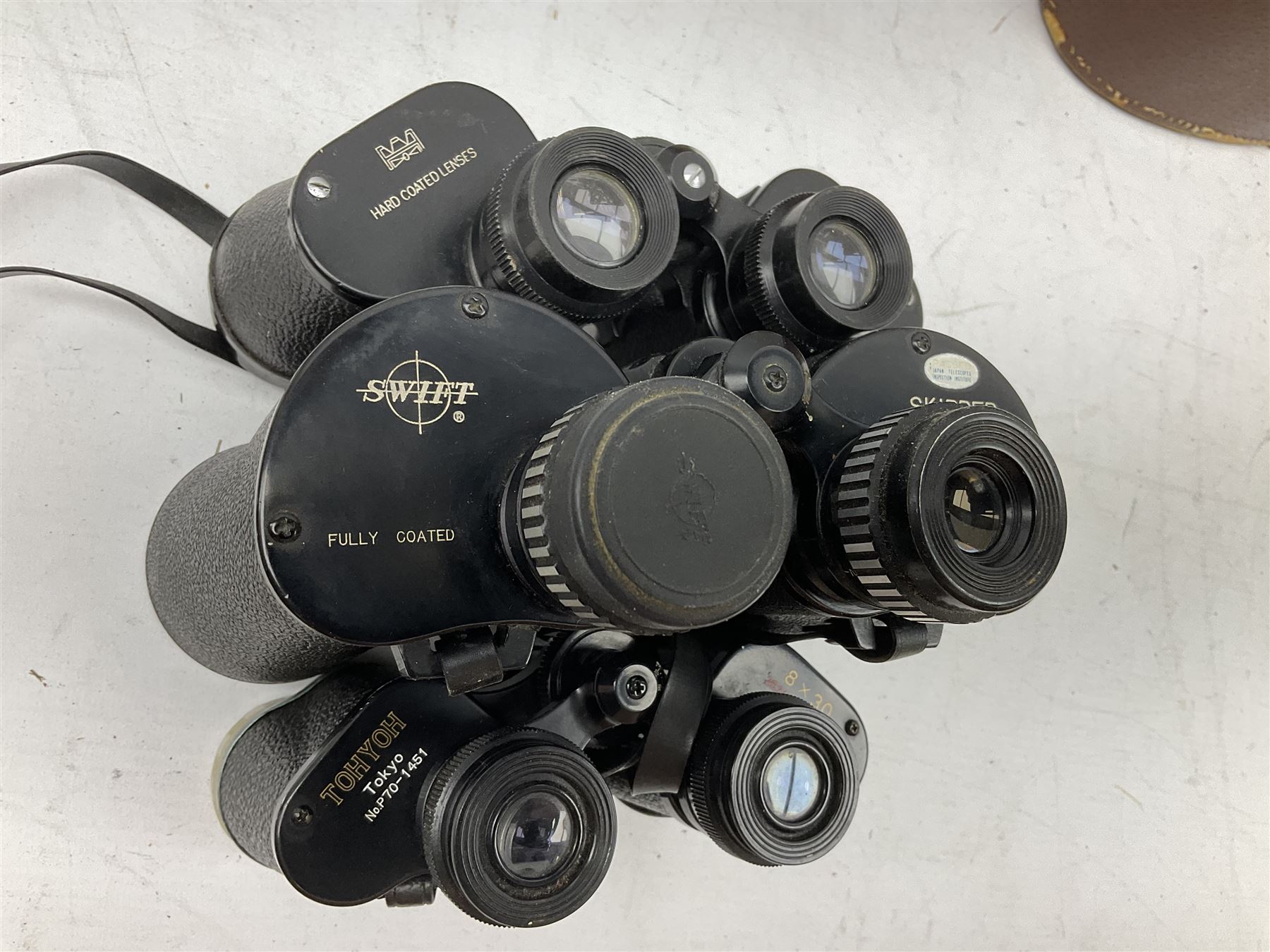 Twelve pairs of binoculars to include BWCF 7x35 Extra Wide Angle, Carl Zeiss Jena Delturis 8x24, Carl Zeiss Jena Jenoptem 8x30W, Chinon Countryman 10x50,  Ajax 8x30, Regent 16x50, etc,  some with cases