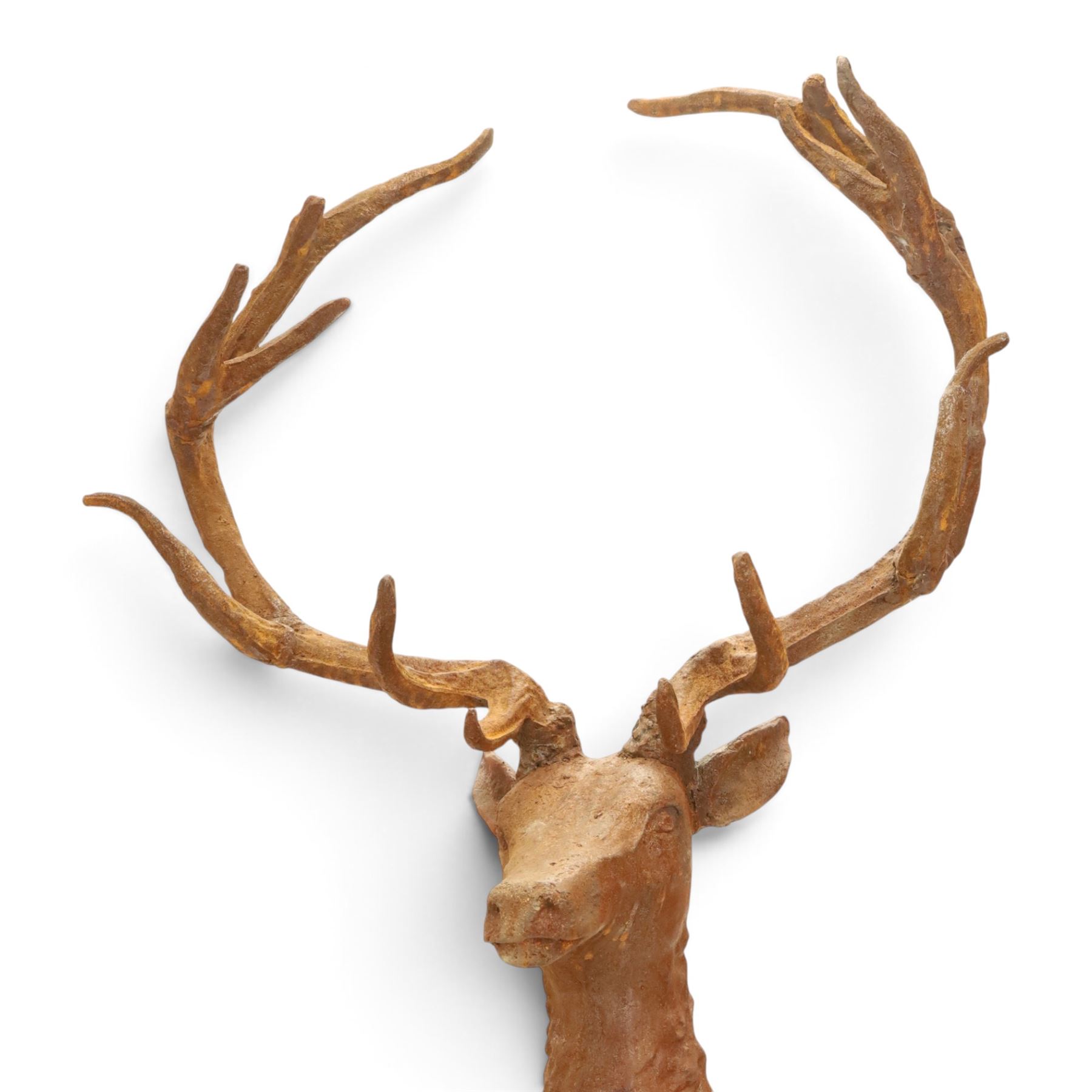 Pair of cast iron stags, upon a on moulded rocky plinth, standing alert 