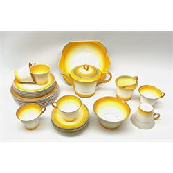 A Shelley Art Deco tea service, decorated in pattern no W12405, with bands of grey, orange and yellow, comprising teapot, open sucrier, milk jug, cake plate, six teacups, six saucers, six side plates, and six dessert plates. 