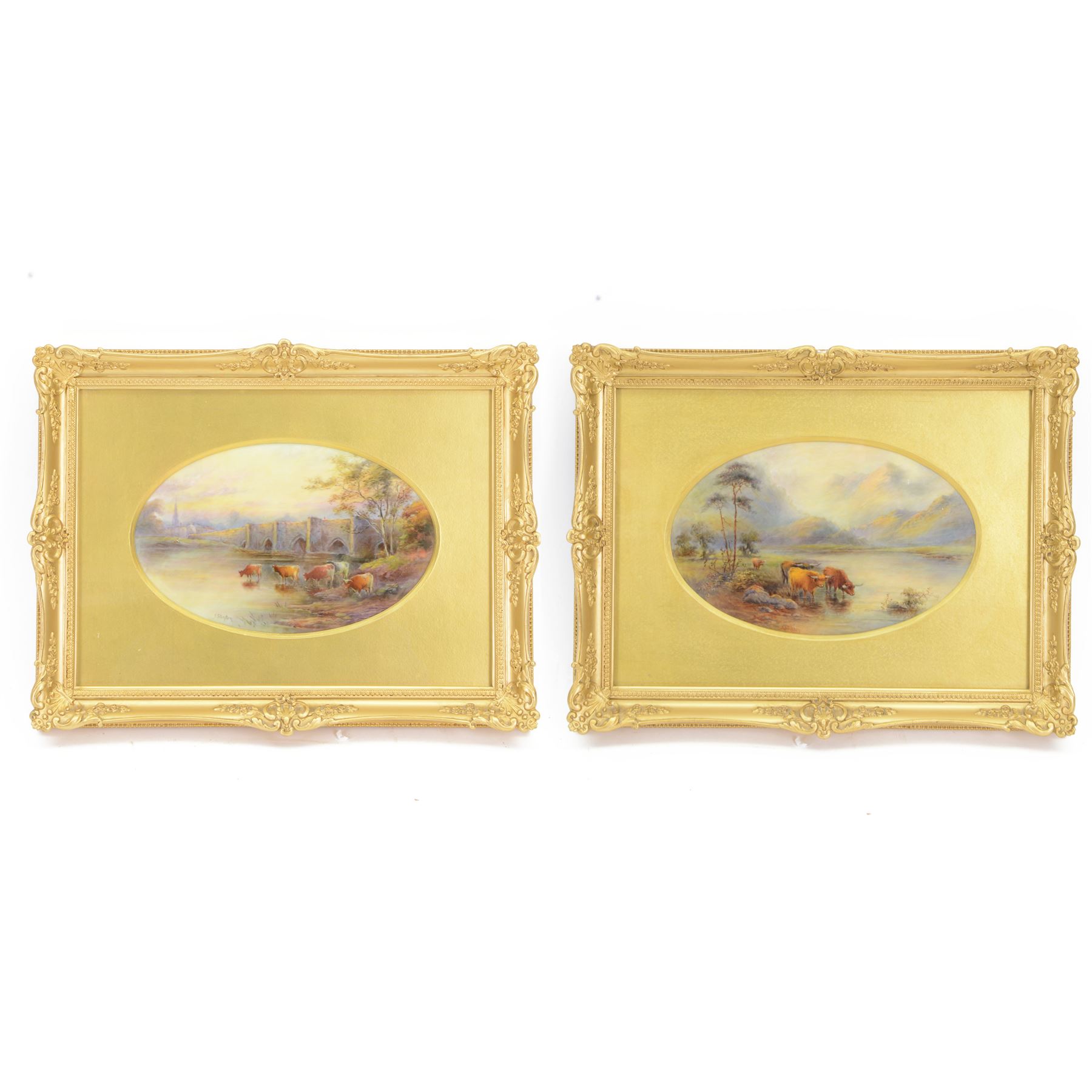 Pair of turn of the century Royal Worcester oval porcelain plaques painted by John Stinton, the first example depicting highland cattle watering against misty mountains, titled 'Loch Lomond' verso, the second depicting cows watering before a bridge with church in the distance, titled 'Bakewell Bridge Derbyshire', each signed J Stinton, each with puce printed mark verso, and date codes for 1899 and 1900, each contained within gilt frame with mount, plaques approximately 14.5cm x 23cm, overall 29.5cm x 38cm