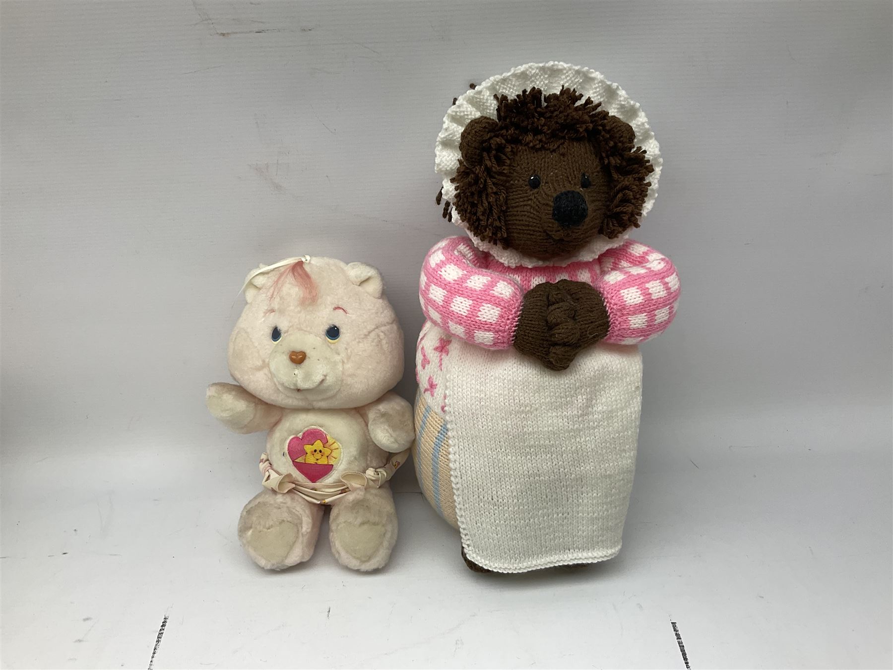 Ten soft tots including Chad Valley Lenny the Lion; Snoopy type dog; Fluffy Hedgehogs; pink Care Bear; souvenir bears for Niagara Falls, Benjamin Franklin and Andre Rieu; Rocky Mountaineer Traindriver; knitted Mrs. Tiggy-Winkle etc; all unboxed (10)