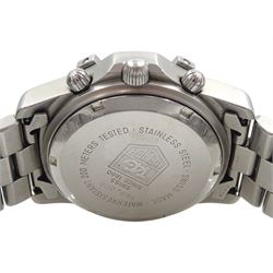Tag Heuer 2000 gentleman's stainless steel automatic chronograph wristwatch, Ref. 169.306, black dial with triple register recording hours, minutes and continuous seconds and date aperture, boxed with papers