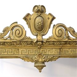 Large late 19th century gilt framed overmantel mirror, urn pediment above a foliate and Greek key frieze, egg and dart beaded edges, enclosing a plain mirror plate, with scrolled lower sections
