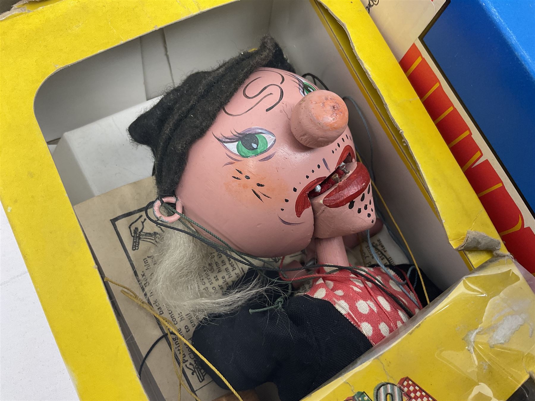 Three Pelham puppets - 'Brains' from Thunderbirds in blue/yellow box; Witch in yellow window box; and Macboozle in brown box (3)