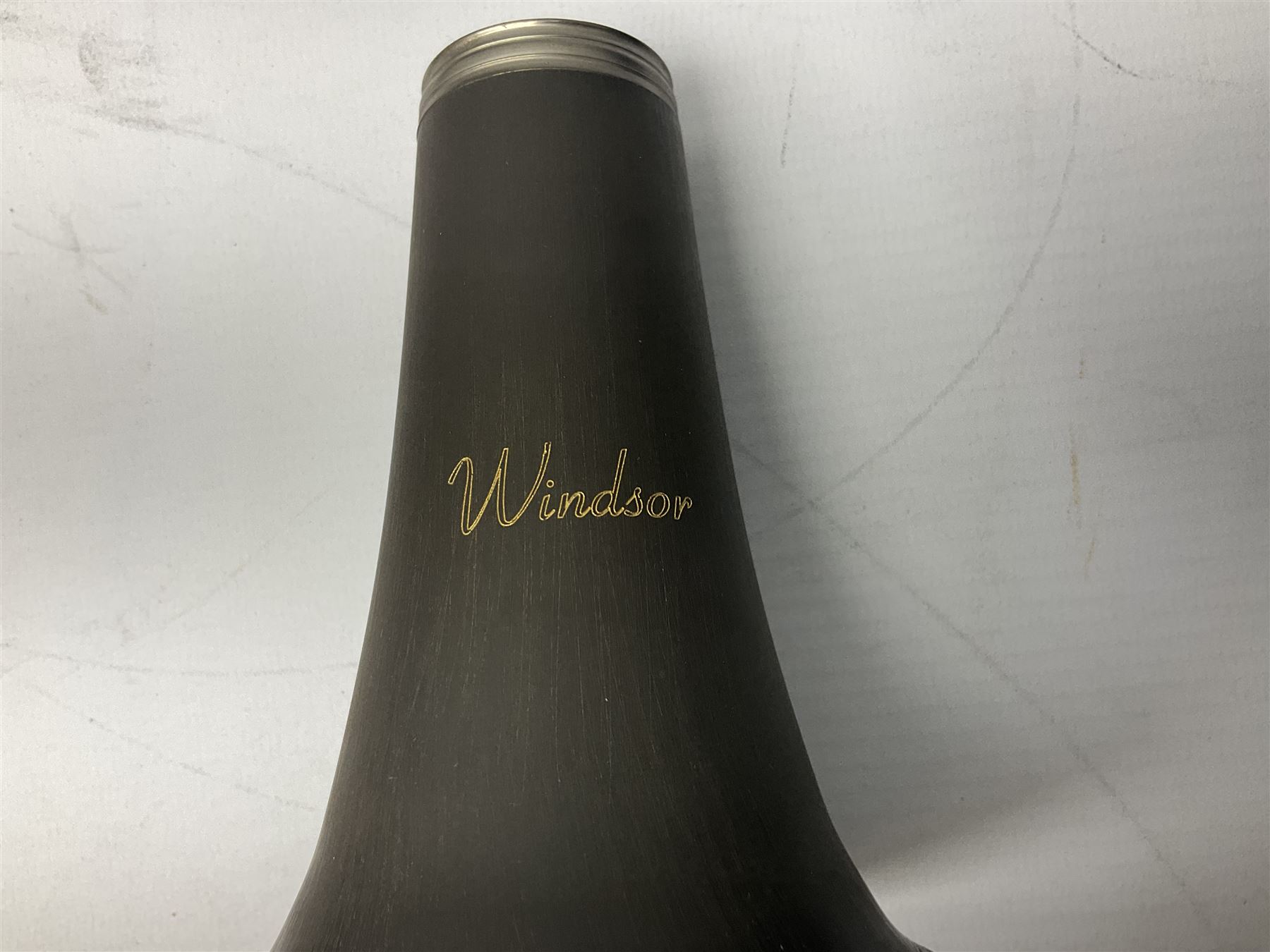 Windsor five-piece clarinet, serial no.EK05580; and Selmer Console clarinet with B&H mouth-piece; both cased (2)