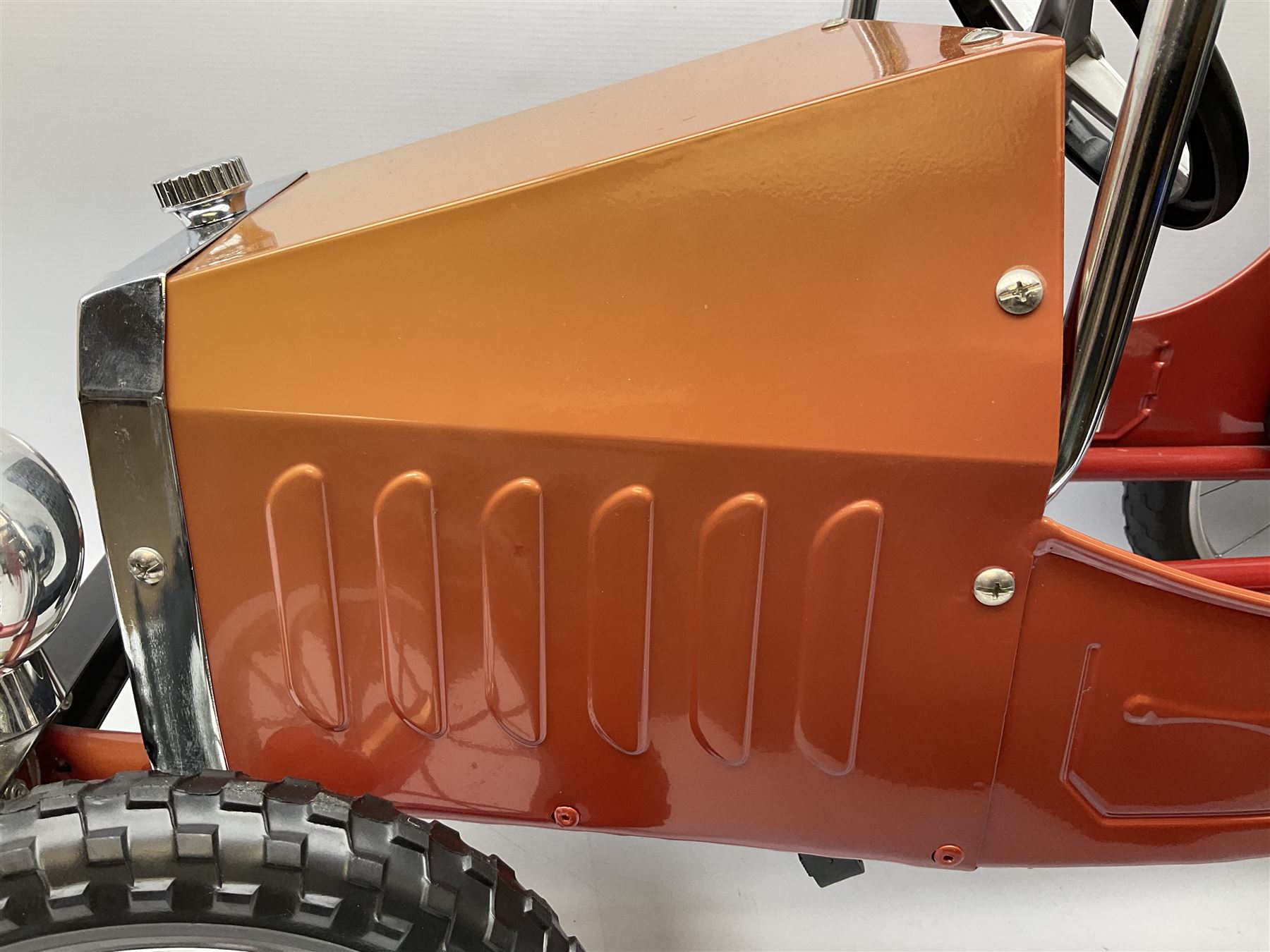 Red child's tin-plate pedal car with chrome detail, by Posh Paddles, Scarborough, H56cm, L80cm