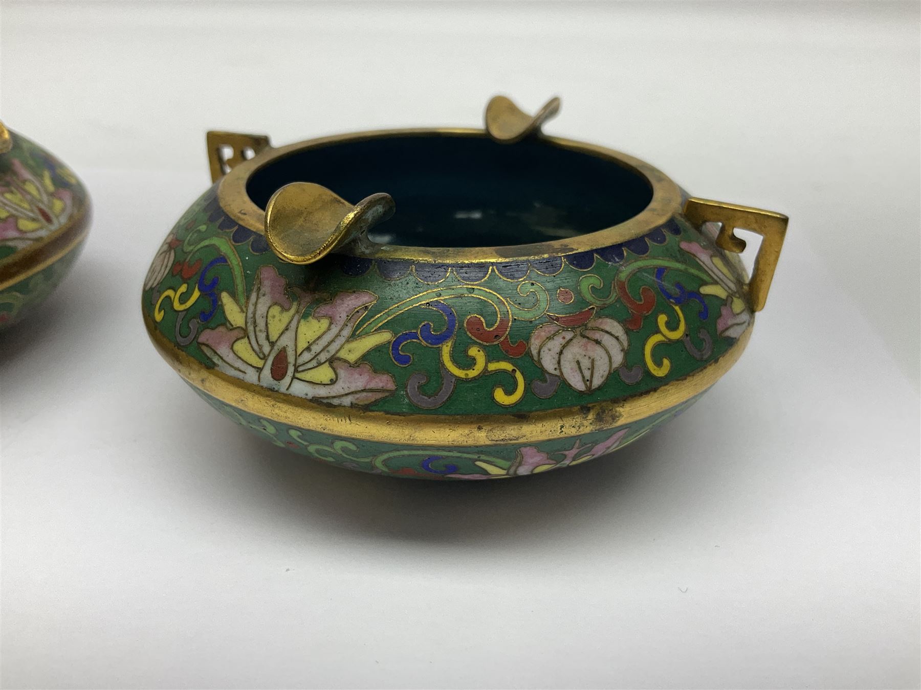 20th century Chinese cloisonne enamel smoking set, comprising two ashtrays, box and tray, with floral and foliate scrolling on green ground