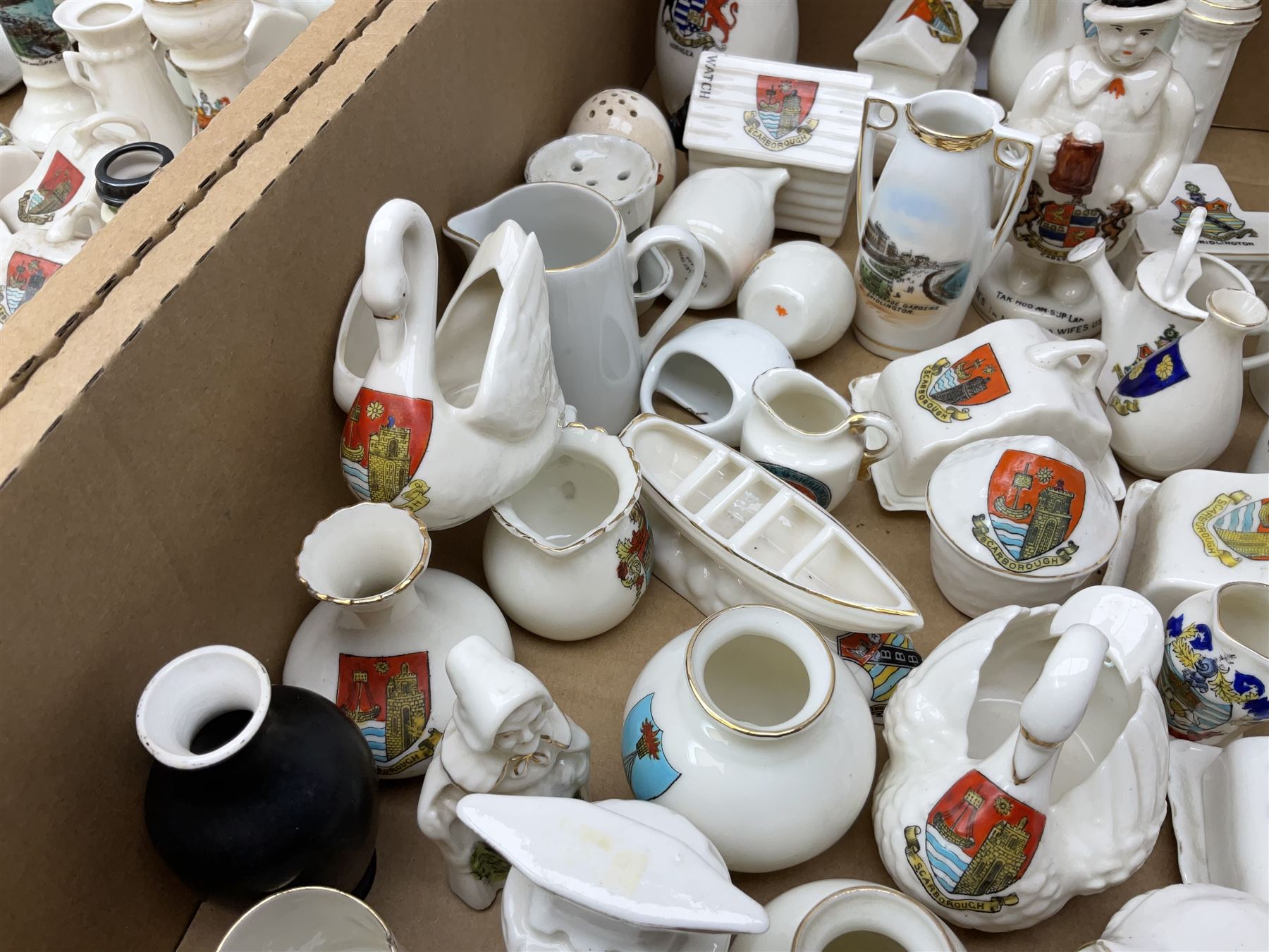 Collection of crested ware, to include Scarborough Willow Art coal truck, Whitby Willow Art Burns and Highland Mary figure group, Carlton China beer drinker 'Tak Hod an Sup Lad', and 'Here's ta me an'ma wife's usban', lighthouse, boat, Kingsway Art China Sir Walter Scott's Chair, butter dishes, candlestick, pianos etc