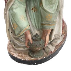 20th century painted plaster icon figure depicting one of the three wise men from a nativity sceen, kneeling and presenting his gift, H54cm 