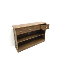 Oak sideboard, projecting top, four drawers, single shelf on platform base 