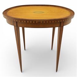 Early 19th century Sheraton revival satinwood oval table, shell motif to the centre bordered by walnut veneer, with inlaid banding, supported on square tapering legs terminating in brass feet