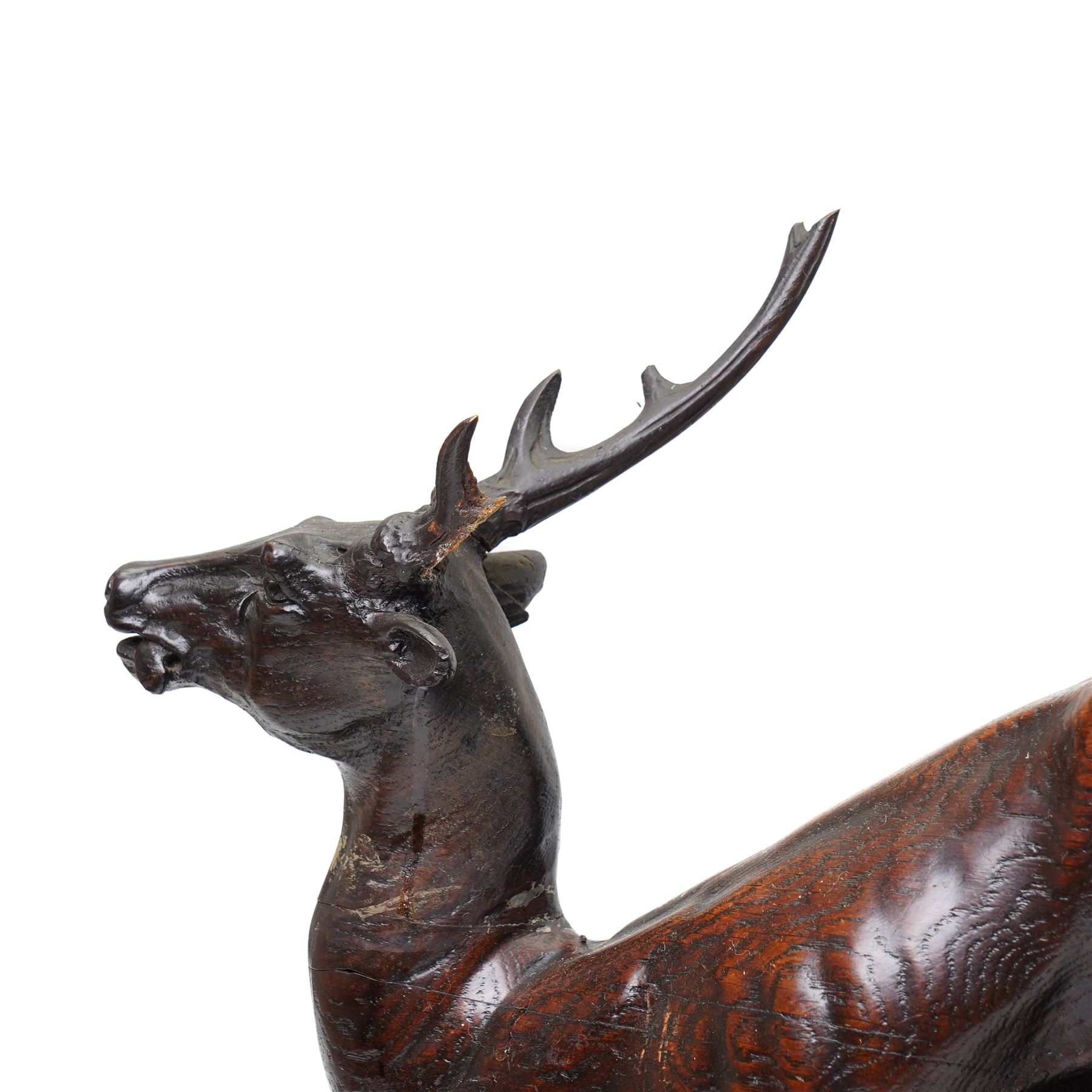 19th-century-8-day German Black Forest mantel clock c1880, with a carved oak case depicting a hunting scene with a stag pursued by hounds amidst rockwork and oak foliage, fitted with a French Parisian movement with a cast brass dial enclosed within a glazed brass bezel with a pendulum adjustment arbor, cartouche blue-on-white enamel  Roman numerals, engraved five minute Arabic's and contrasting steel Fleur-di-Lis hands, twin train going barrel movement with a recoil anchor escapement and countwheel strike. With pendulum.  