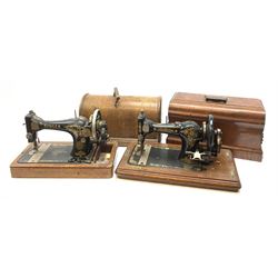 Two vintage sewing machines, the first marked Federation, in mahogany case, the second marked Singer, in oak case. 