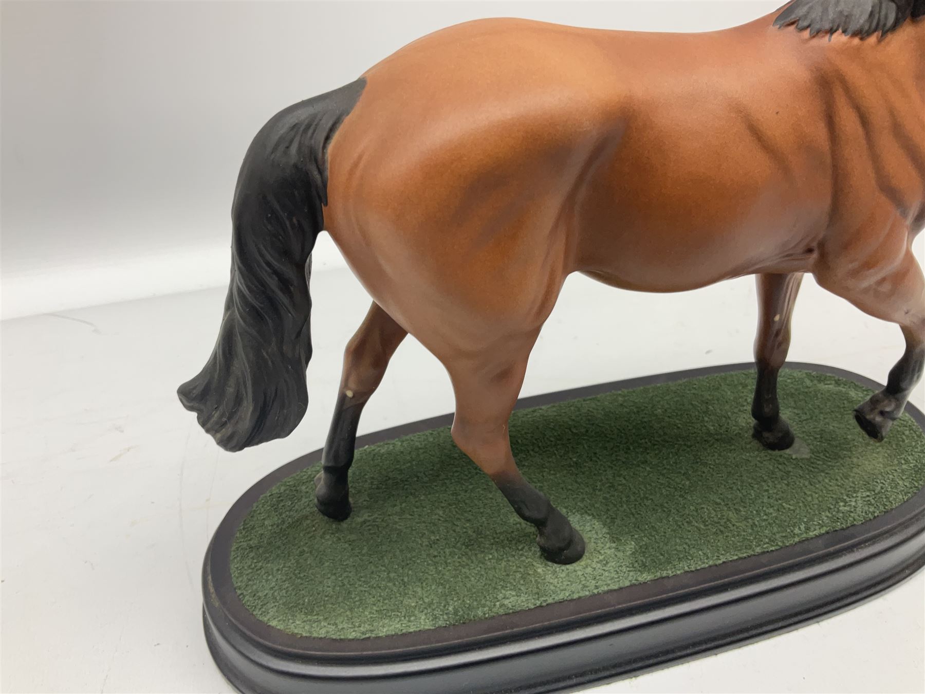 Beswick 'Mill Reef' horse figure, on a wooden plinth together with Beswick Ware horse figure 'Red Rum' on wood plinth, both with printed mark beneath