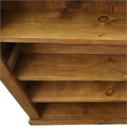 Indigo Furniture - large rustic oak open bookcase, with four adjustable shelves, above a plinth base 