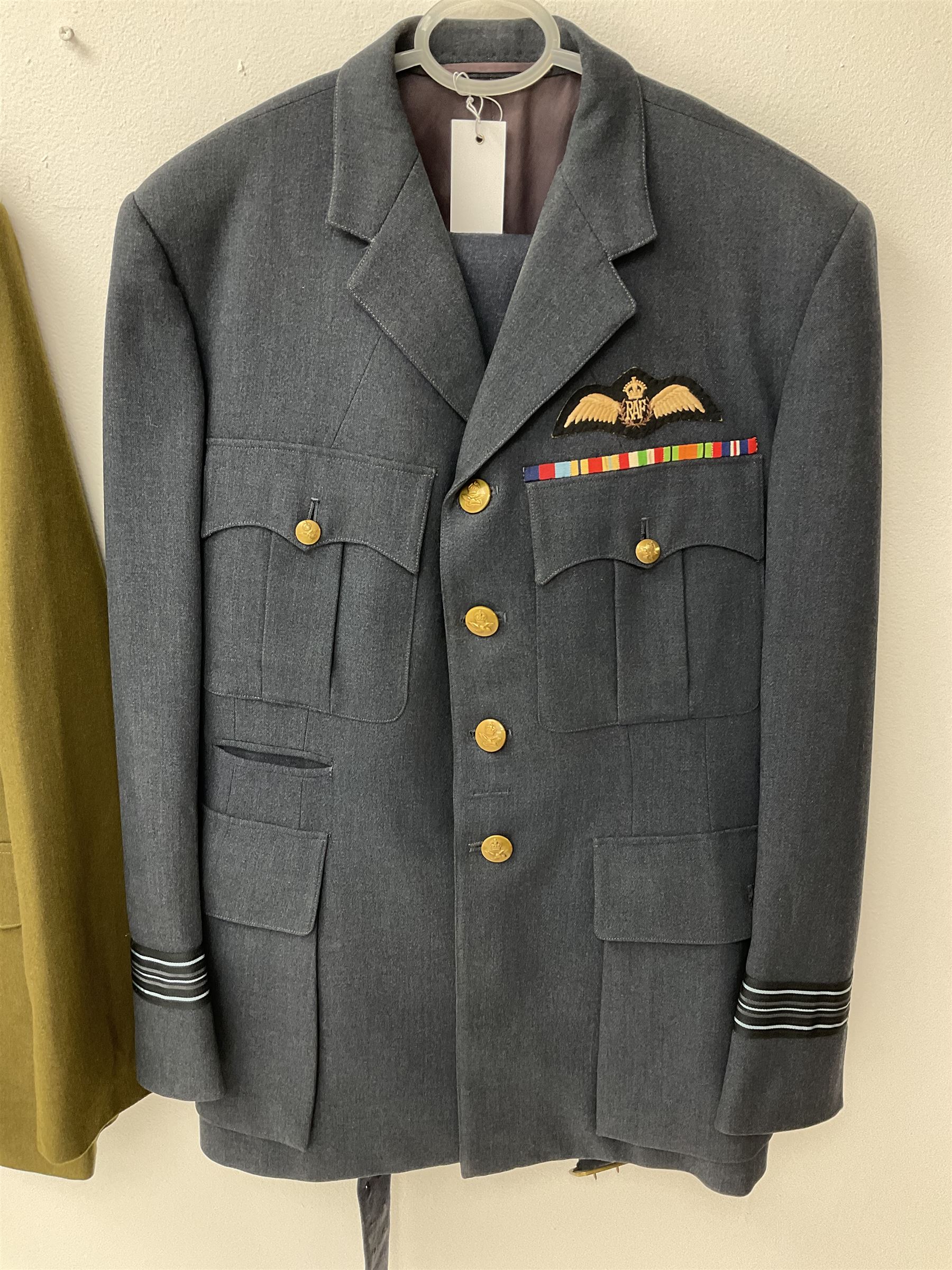 RAF Flight Lieutenant's uniform with peaked cap and WW2 ribbon bar; WW2 gas mask in blue canvas bag dated 1942; flying helmet date 1984; and British Army Major's uniform with Staybrite buttons and peaked cap