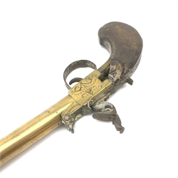 Early 19th century Belgian brass cannon barrelled flintlock overcoat pistol with 12cm spring bayonet, Liege (ELG) proof marks, foliate engraved boxlock action with sliding top safety, fluted and chequered walnut grip with stylised shell side plates, L40cm overall extended