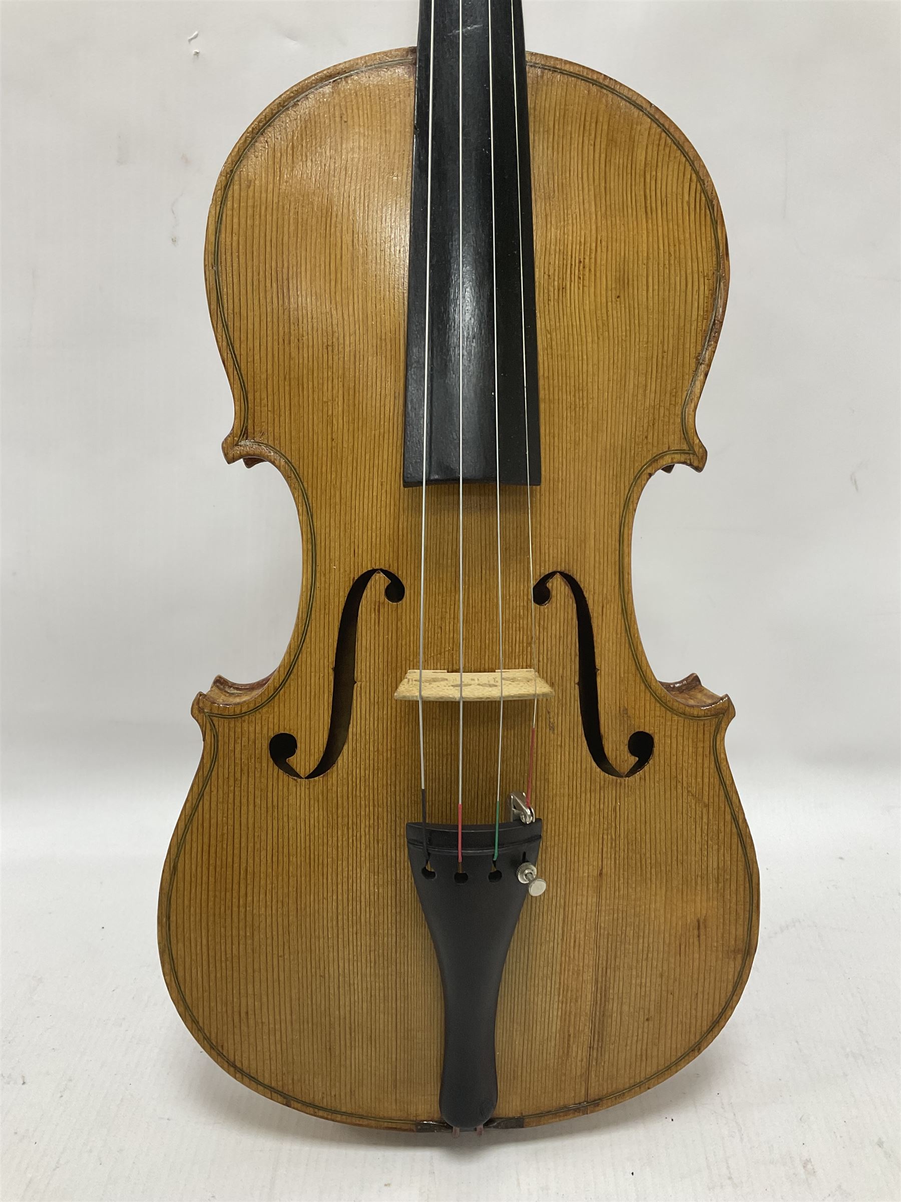 Copy of a full size Stradivarius violin, with an ebonised fingerboard, tailpiece and tuning pegs Length 60cm