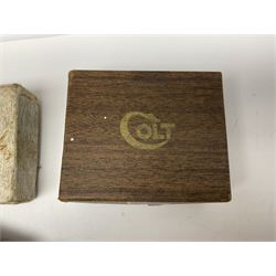 Six pairs of revolver grips;  pair of Lightwood & Son Ltd powder/shot measures in original box; and boxed Colt hammer shroud 