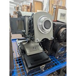 Collection of projectors, epidiascopes, magic lantern and similar, including Bell & Howell 621 projector, mahogany and brass magic lantern, Helper 6S projector, Leitz epidiascope, Zeiss epidiascope, Johnson Optiscope, etc