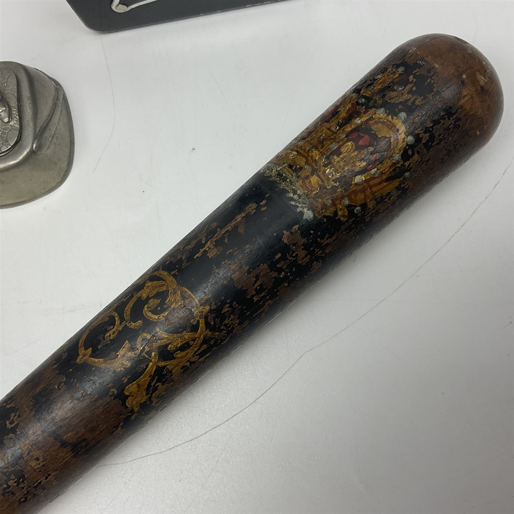 Police - Victorian turned hardwood truncheon with traces of decoration and VR cypher L42cm; Humberside Police helmet with Queens Crown helmet plate; hand lamp inscribed 'The Inspector'; and small pair of pewter figures of police officers (5)