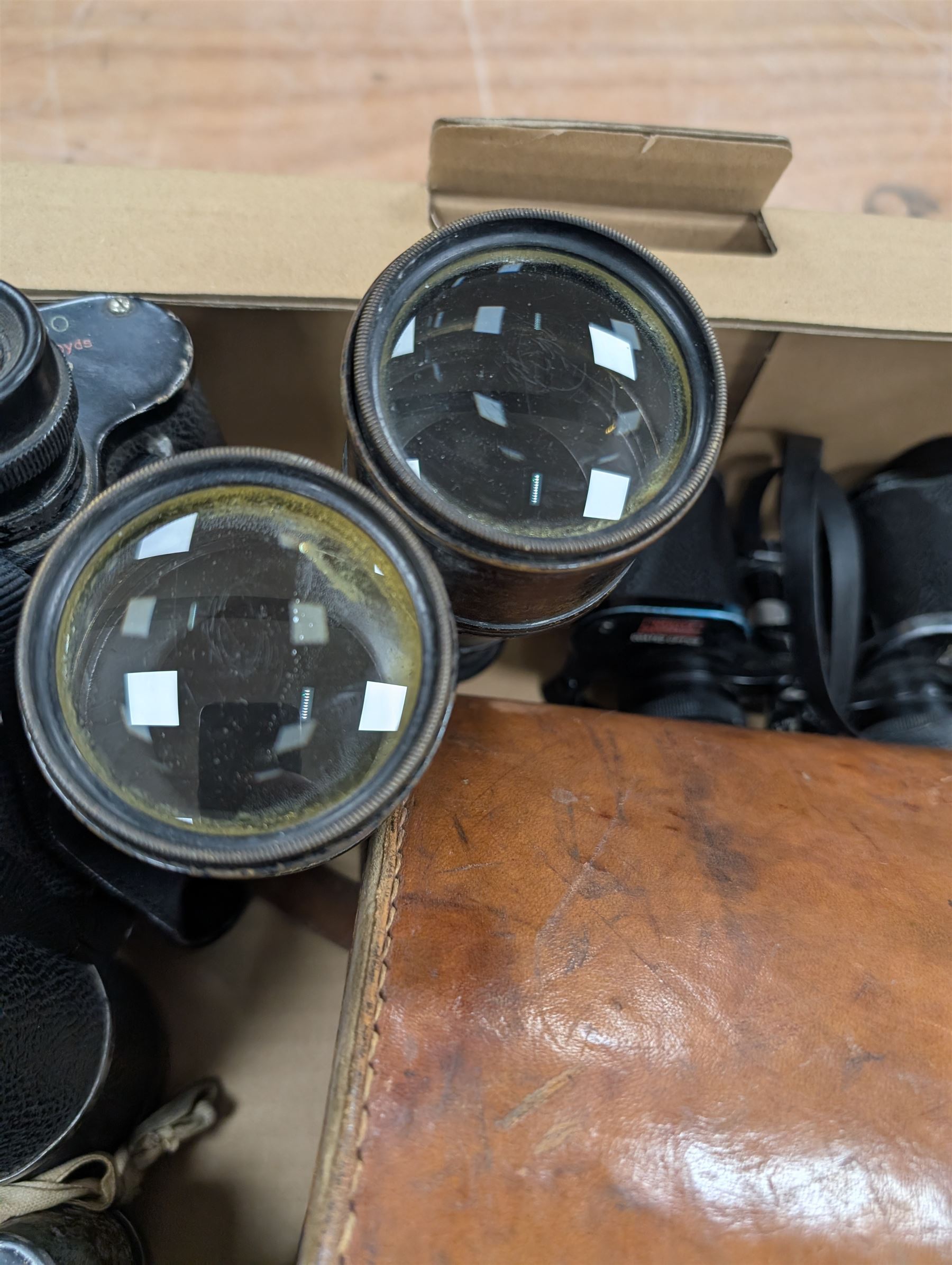 Nine pairs of early 20th century and later binoculars, including Tento 20x50, Nagoya Panoramic 8 x 30, Orr & Sons Madras, DRW 10 x 50, etc some with cases