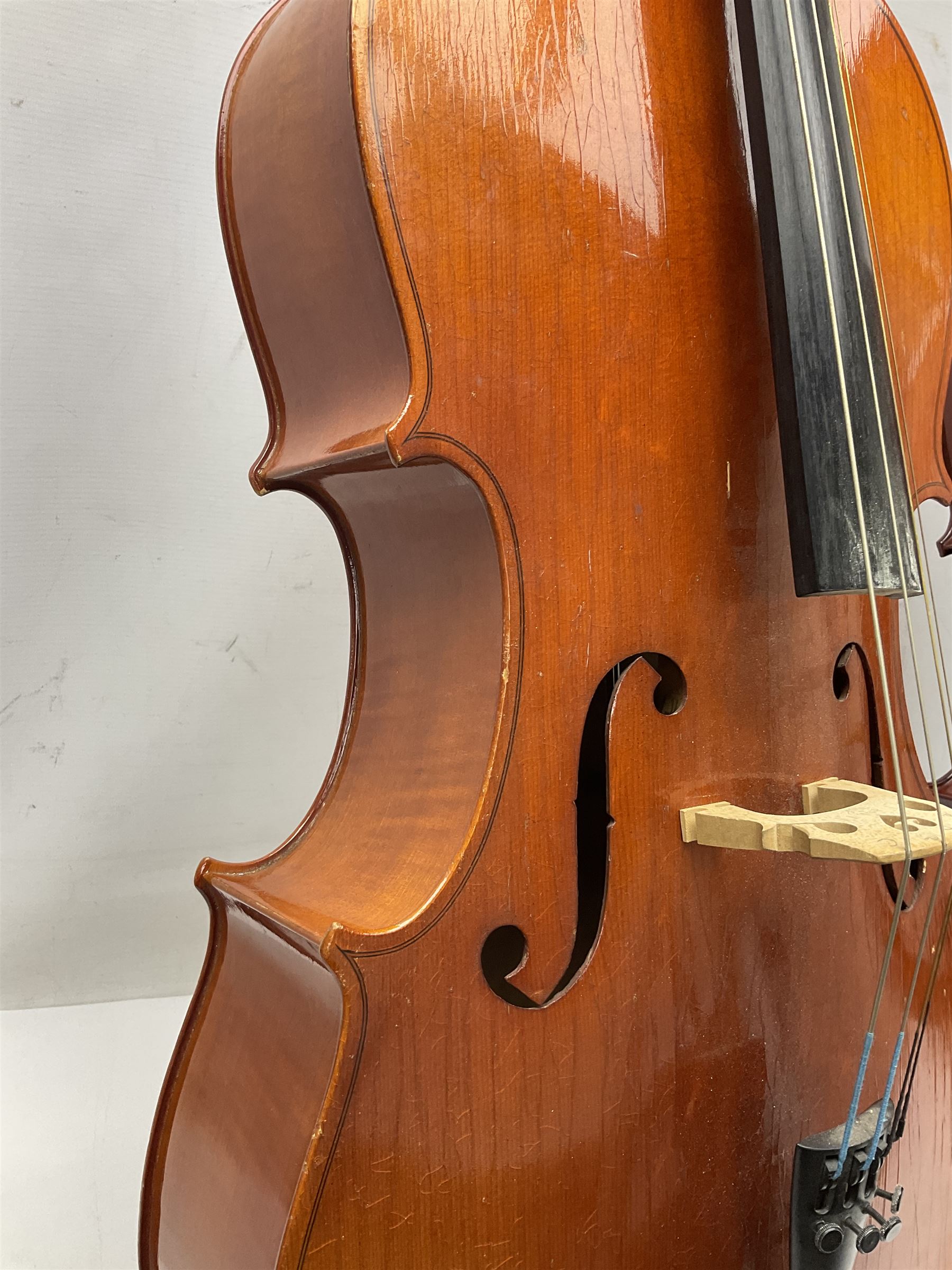 Modern Hungarian half-size cello with 69cm two-piece maple back and ribs and spruce top L114cm overall; and Stentor half size cello bearing label 'The Stentor Student II'; each in soft carrying case (2)