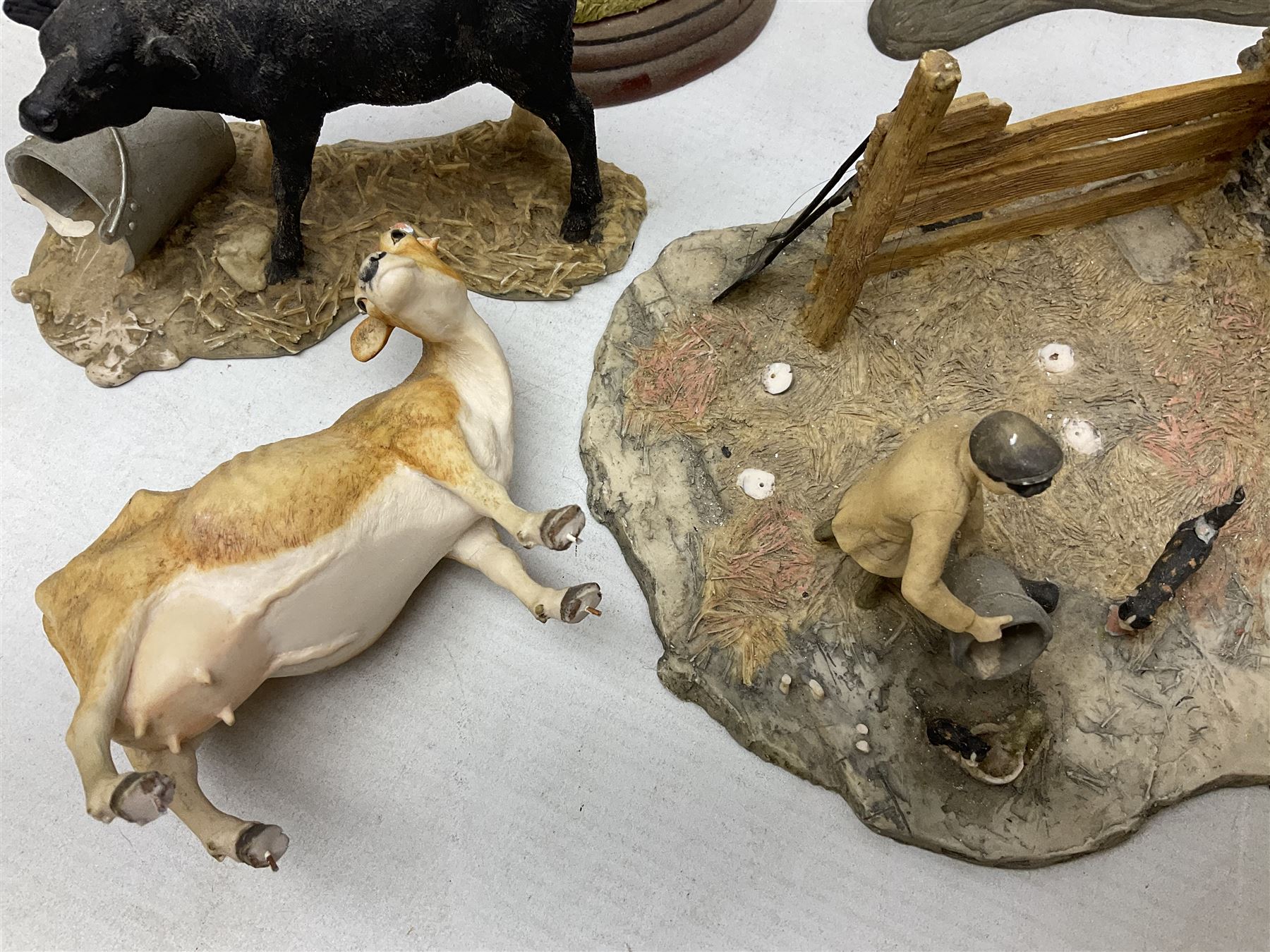 Collection of Border Fine Arts figures, comprising Exmoor Stallion A4058, Highland Mare & Stallion A2691, Welsh Cob A20804, On The Farm A0167, calf figure with bucket and figure group of cow and farmer with cat and kittens (6)