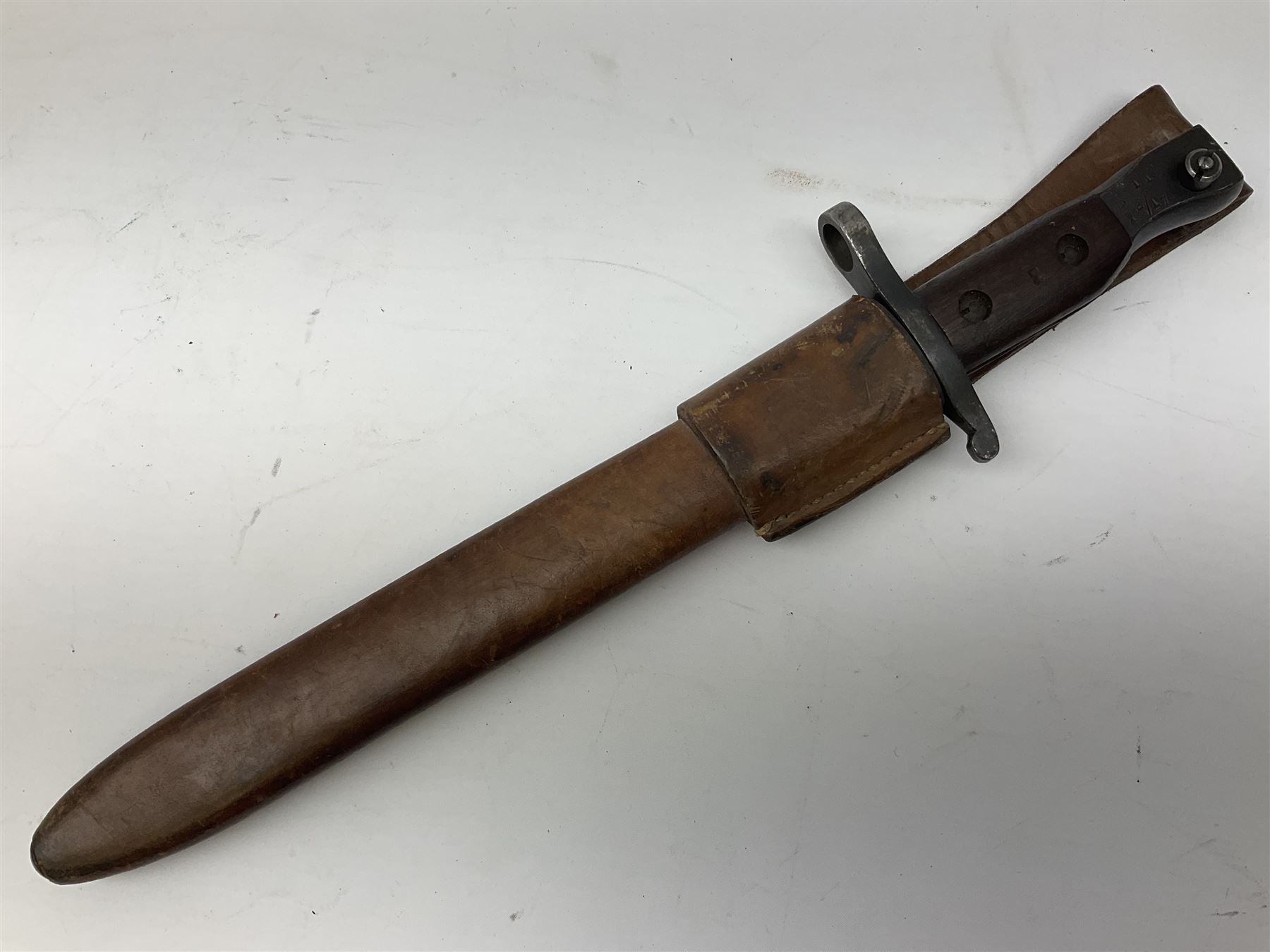 WW1 American Remington P14 rifle bayonet Model 1913, the 43cm fullered steel blade dated 5 17; in metal mounted leather scabbard L57cm overall; and WW1 Canadian Ross Rifle Co.1907 Model Mk.II bayonet, dated 2/17; in leather scabbard with frog (2)