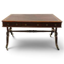 Regency inlaid mahogany and brass mounted library table, the rectangular top inset with gi...