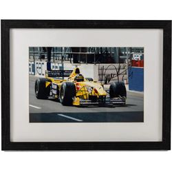 Ten signed Formula 1 photographs, comprising eight Damon Hill examples, Jenson Button and a Nigel Mansell example, nine with certificates of authenticity from Write Stuff Autographs, all framed, largest H47cm, W67cm