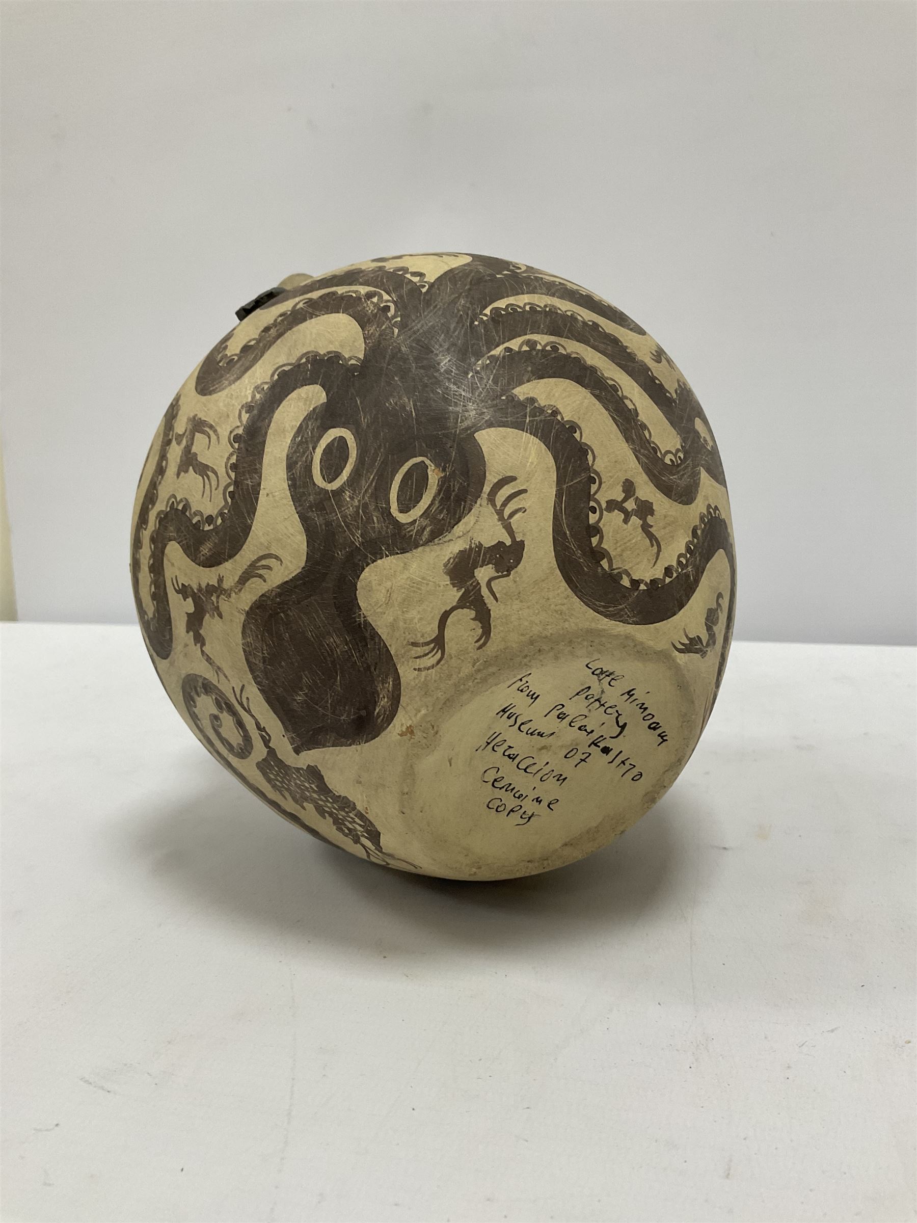 Reproduction Ancient Greek vessel in the style of Crete Minoan period, decorated with marine style ocotopi, with three handles and spout, signed beneath, H20cm