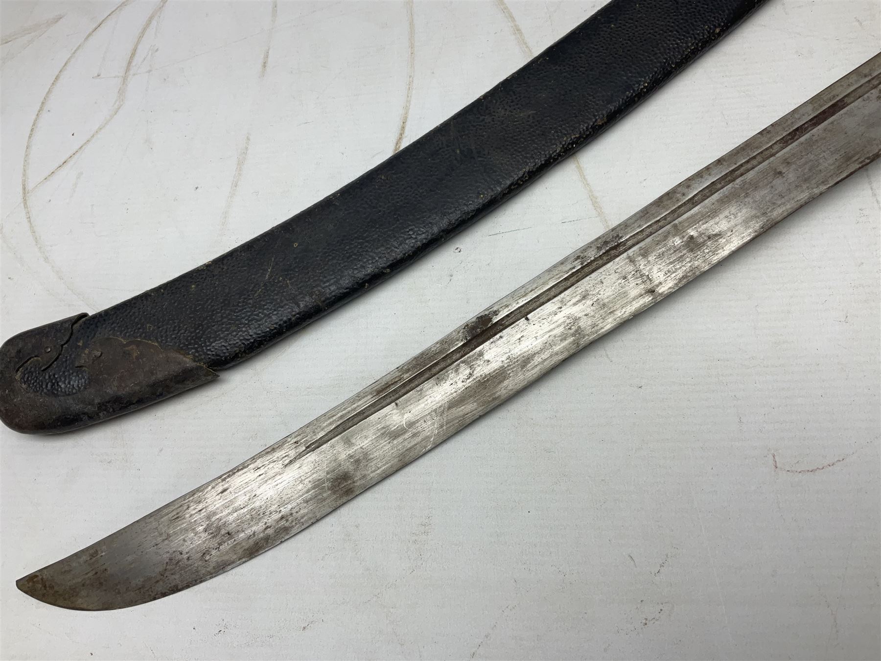 Chinese Boxer Rebellion Period Sword, 69.5cm heavy curved single edge blade with single narrow fuller, plain iron dished circular guard, iron pommel and ferrule with plaited cord bound grip; in skin covered wooden scabbard with iron chape and long suspension mount L95cm overall