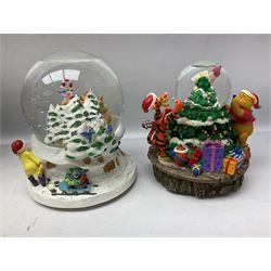 Six Disney Winnie the Pooh Christmas snow globes, comprising large Mr Christmas Holiday Snowfall, An Enchanted Christmas, It's A Small World Christmas 1994,  Tree Trimming, 1995 Christmas At Our House and Christmas Band Concert, together with Mr Christmas Holiday Go Round, all with boxes (7)