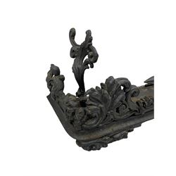 Late 19th century ornate cast iron fire fender, decorated with foliate scrolls