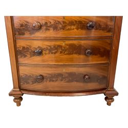 Late 19th century mahogany bow-front chest, fitted with banded cushion drawer with secret catch, above two short over three long graduating drawers, each cock-beaded with turned handles, lower moulded edge over turned feet