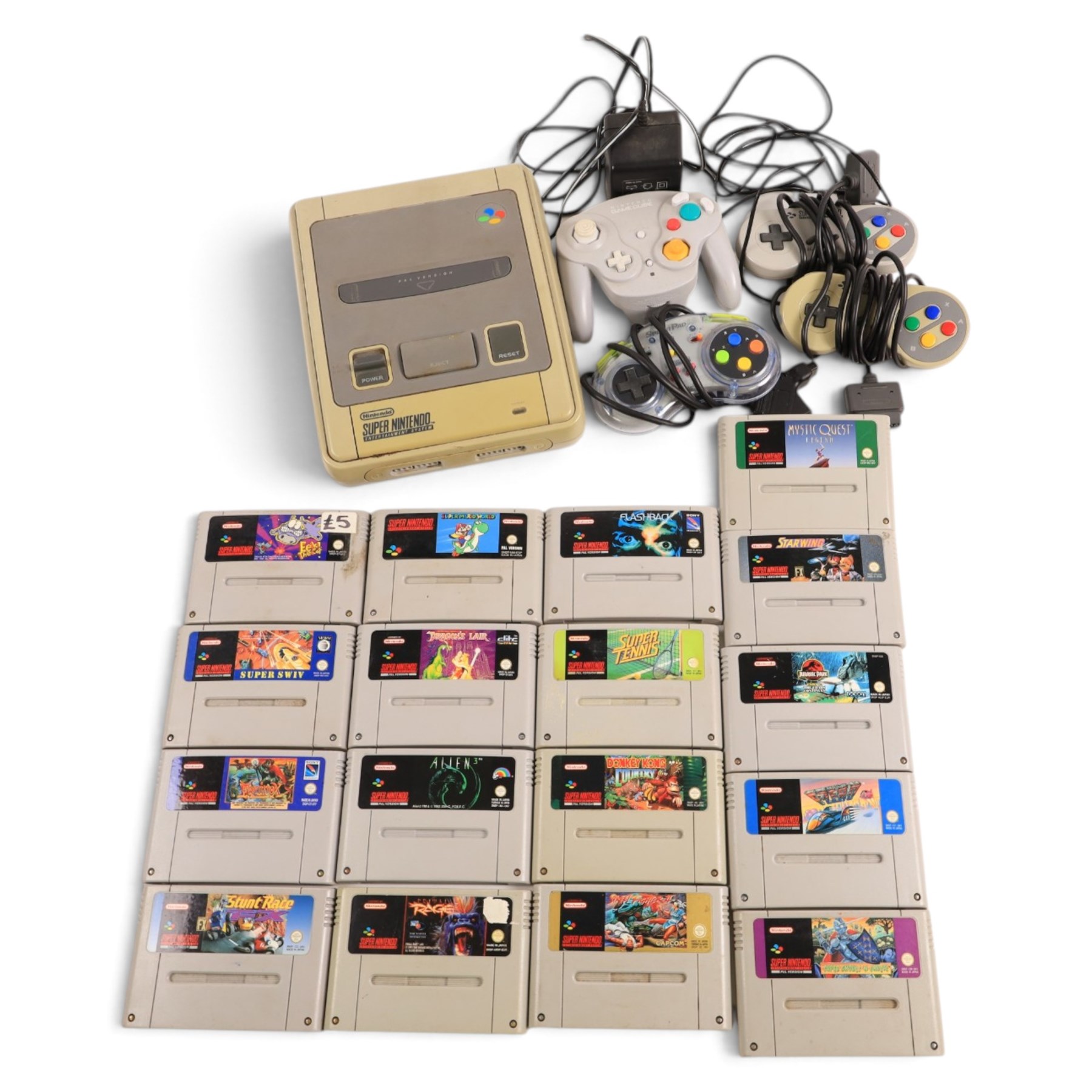 Super Nintendo Entertainment System console, three controllers including a Sprint Pad, a Nintendo Game Cube controller and a collection of SNES games, comprising Mystic Quest Legend, Flashback, Super Swiv, Eek The Cat, Street Fighter II, Dragons Lair, Jurassic Park Part II, Equinox, Donkey Kong Country, Super Mario World, Stunt Race, Super Tennis, Primal Rage, Alien 3, Starwing and F-Zero, all unboxed 