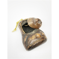 A Japanese carved soft wood inro, modelled as an open mouthed figured and with inset glass eyes, H8.5cm. 